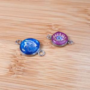 Bracelet cordon Médaille acier, résine et incrustation oeil